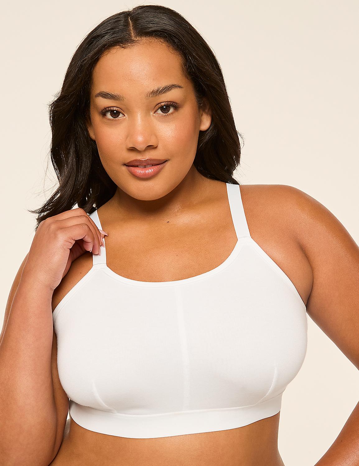 A woman in a white sports bra is posed against a plain, light-colored background. Product Image 3