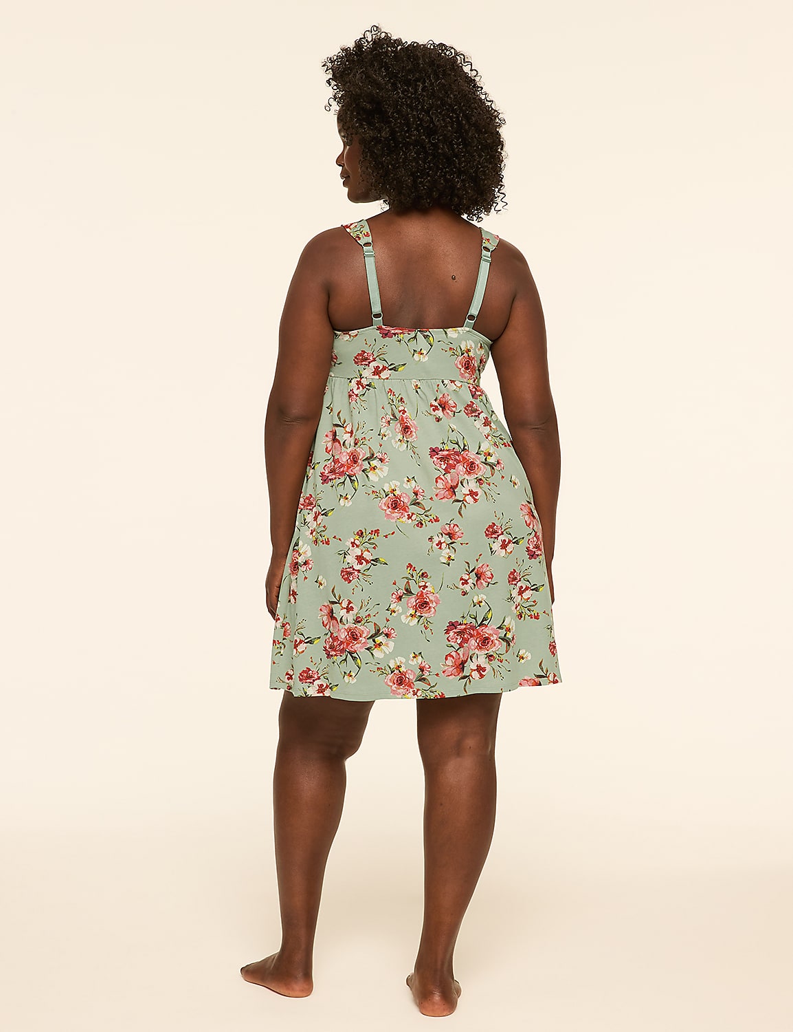 A woman in a floral dress stands with her back to the camera against a plain, light-colored background. Product Image 2