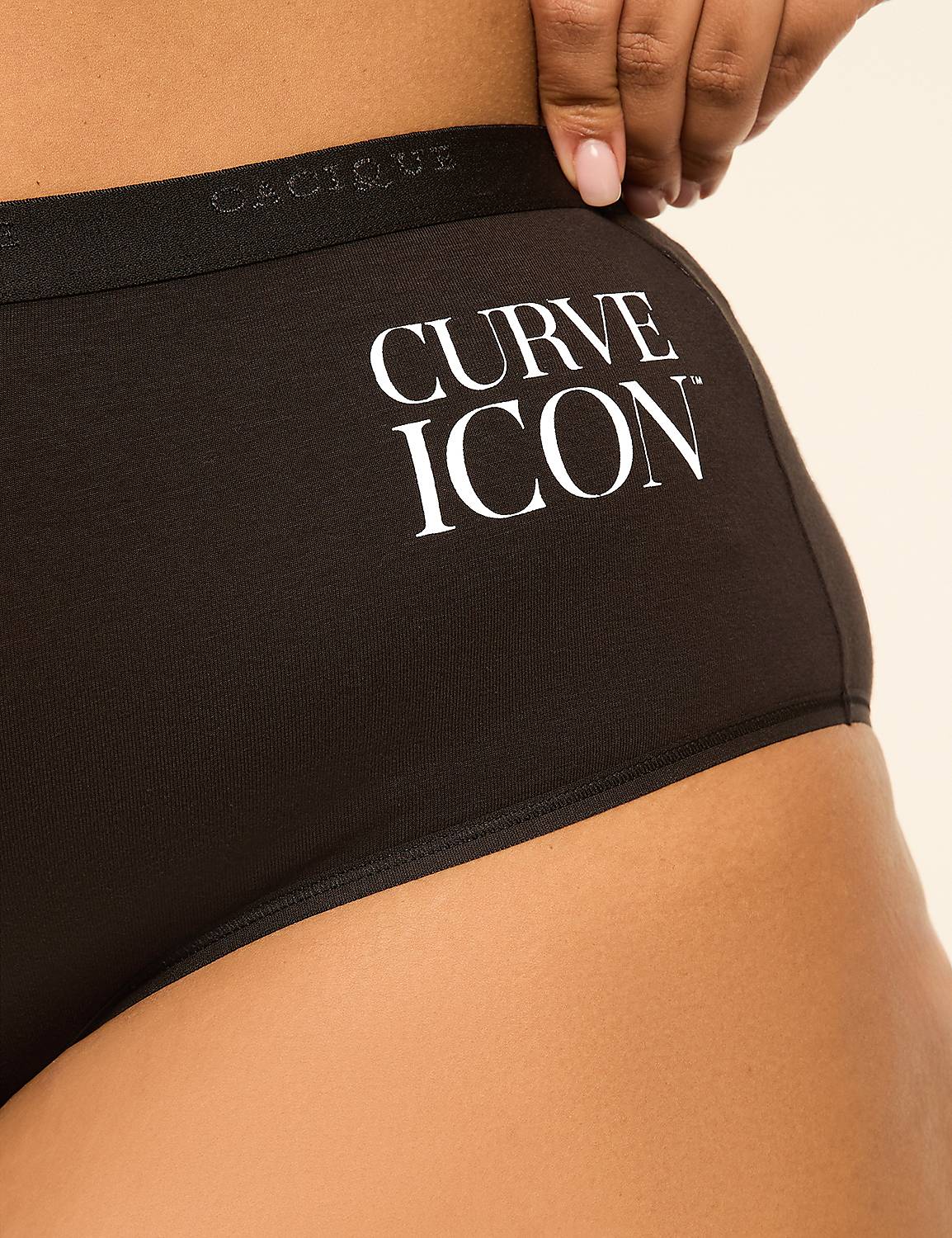 A hand pulls at the waistband of black underwear with "CURVE ICON" printed on it, against a soft, neutral background. Product Image 3