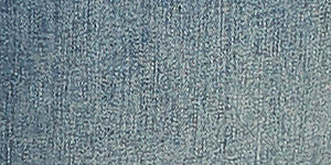 A woman in a teal ombre sweater and flared jeans stands against a plain, light-colored background. Product Image 5