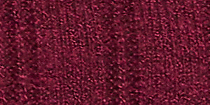 A woman in a purple top and black pants stands against a plain, light-colored background. Product Image 4