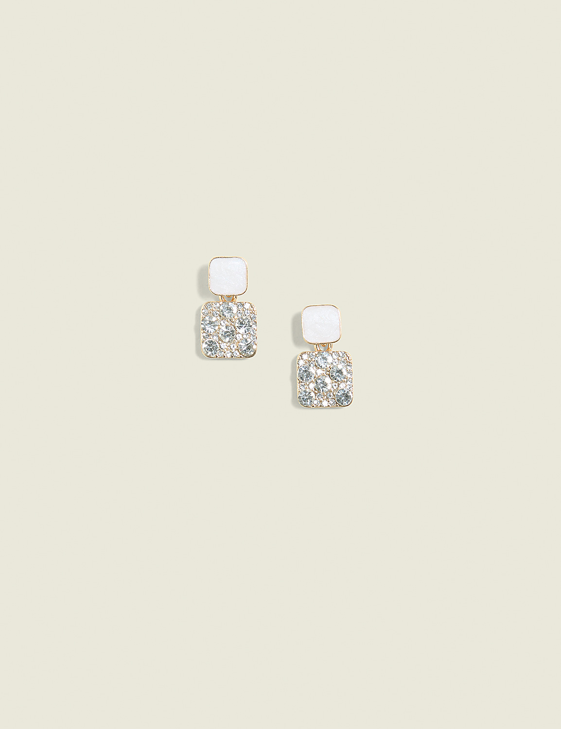 A pair of square, white-topped earrings with sparkling rhinestones dangle against a plain, light beige background. Product Image 1