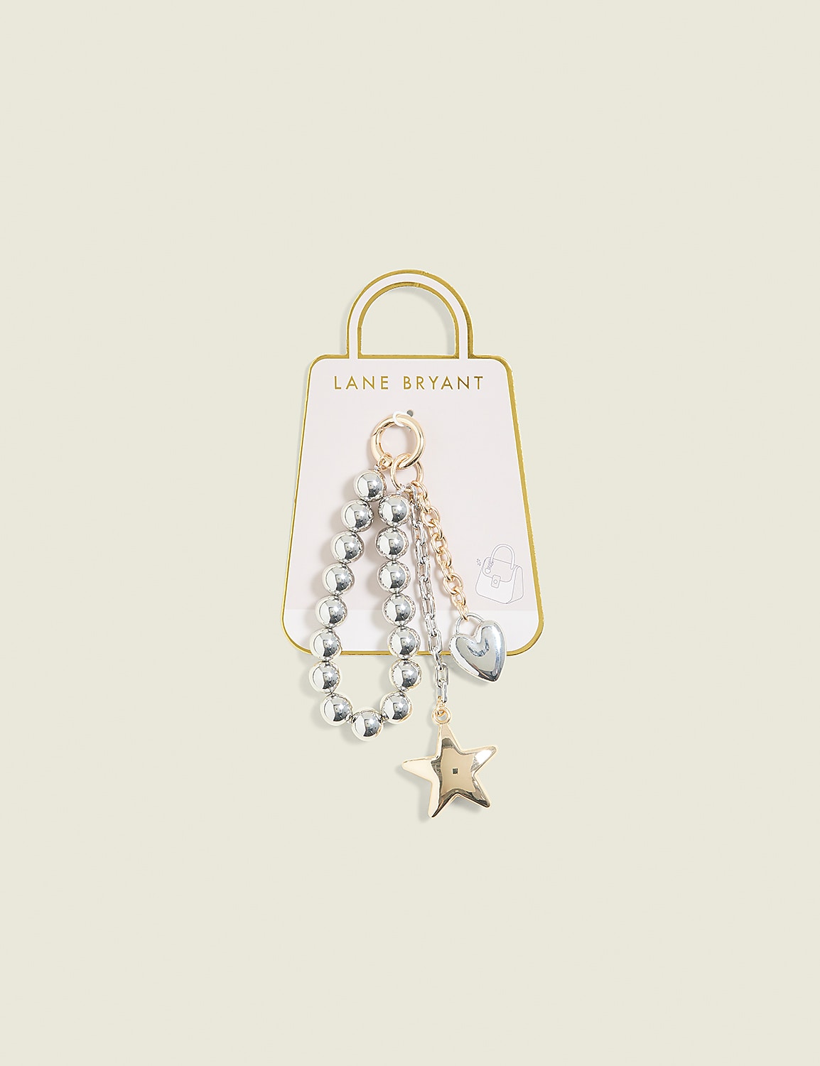 A beaded bracelet with a heart and star charm hangs from a Lane Bryant tag against a pale yellow background. Product Image 1