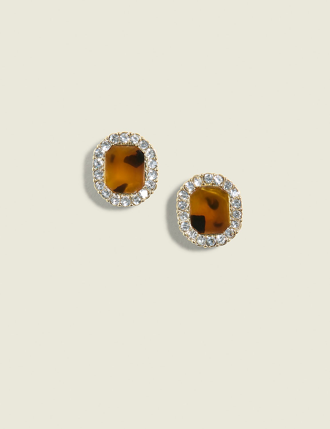 A pair of square tortoise shell earrings with a halo of clear rhinestones are centered against a plain, light beige background. Product Image 1