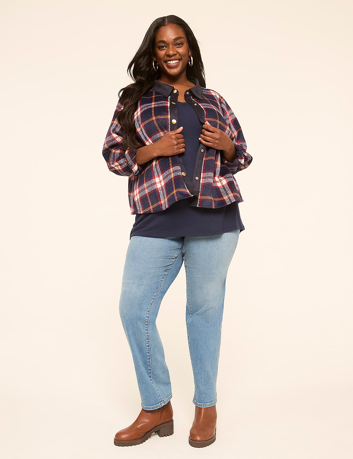 A smiling woman in a plaid jacket and jeans stands against a plain, light background. Product Image 3