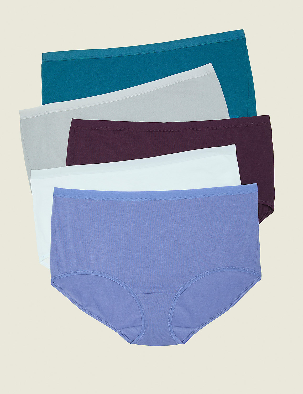 A stack of five pairs of women's underwear in various colors, from lavender at the front to teal at the back, are laid out against a plain, light beige background. Product Image 1