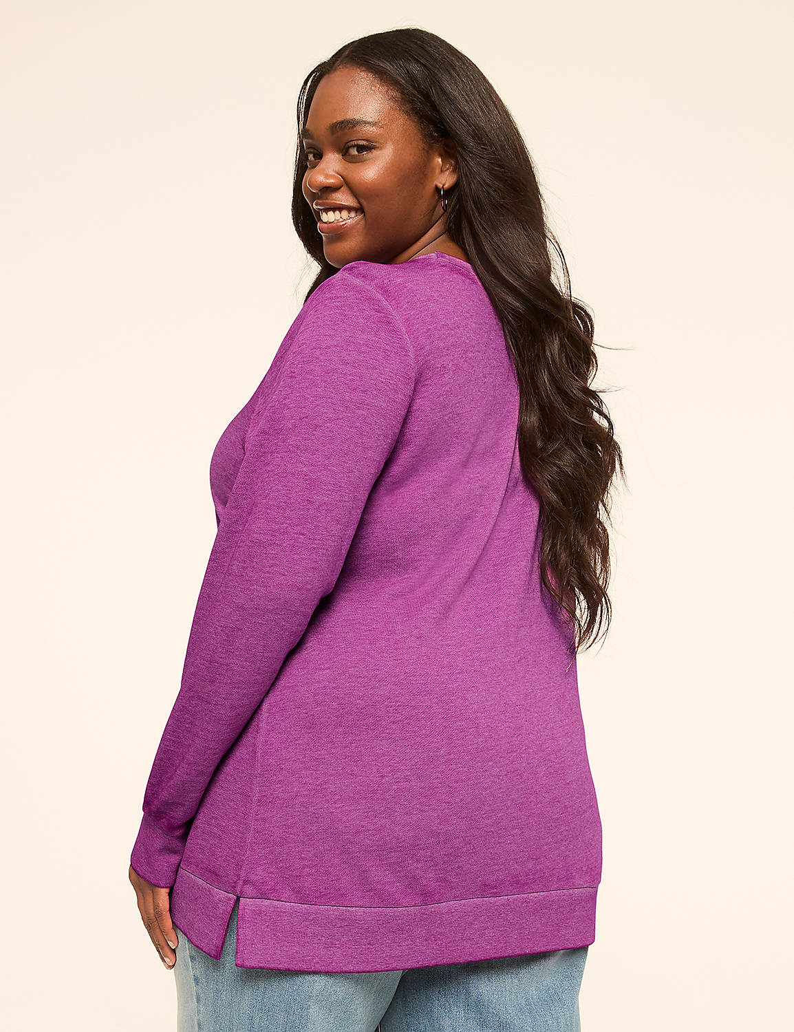 A smiling woman in a pink sweater and jeans stands against a plain, light-colored background. Product Image 2