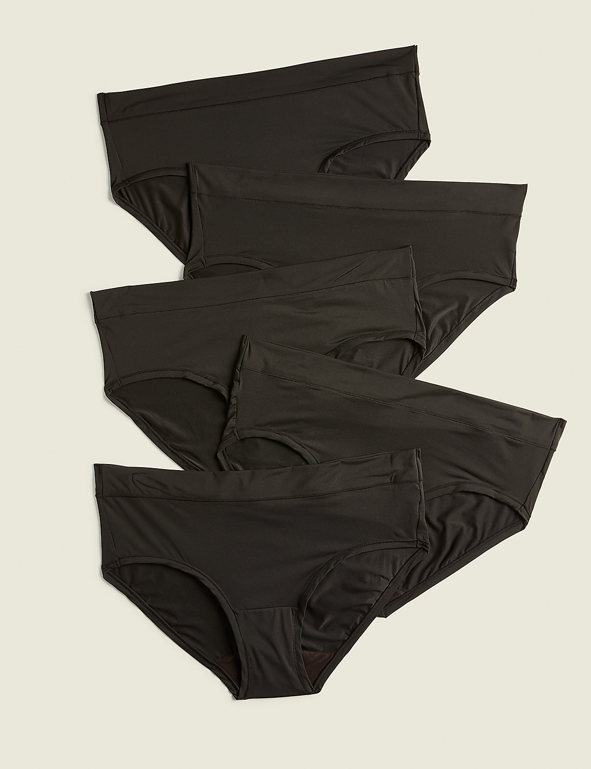 Several black briefs are neatly arranged in the foreground against a plain, light beige background. Product Image 1
