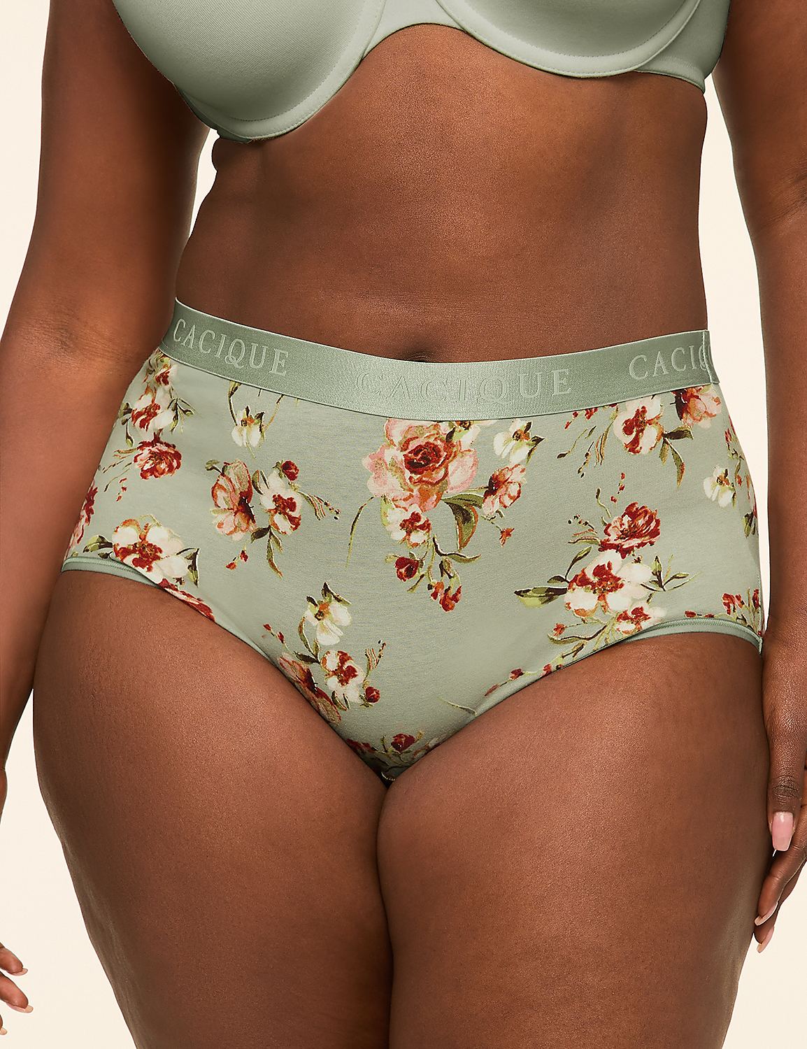 A woman in floral patterned underwear stands against a plain, light-colored background. Product Image 1