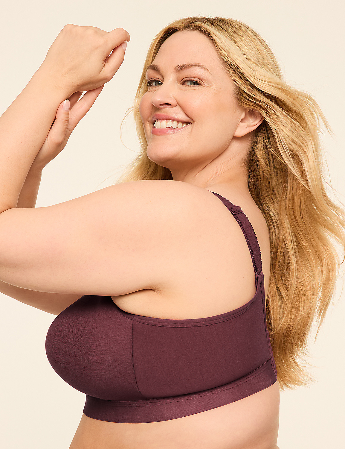A smiling woman with blonde hair poses in a burgundy bra against a plain, light background. Product Image 3