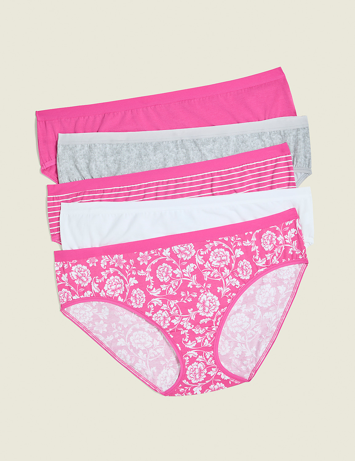 Five pairs of women's underwear, with the bottom pair featuring a pink floral pattern, are neatly stacked against a plain, light beige background. Product Image 1