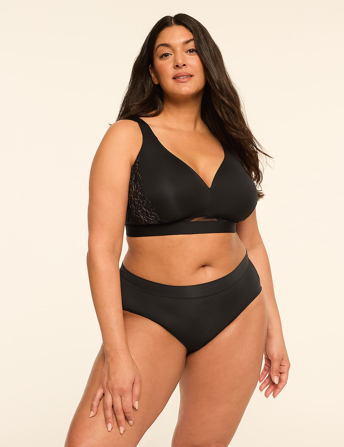 A woman in black lingerie stands against a plain, light-colored background. Product Image 4