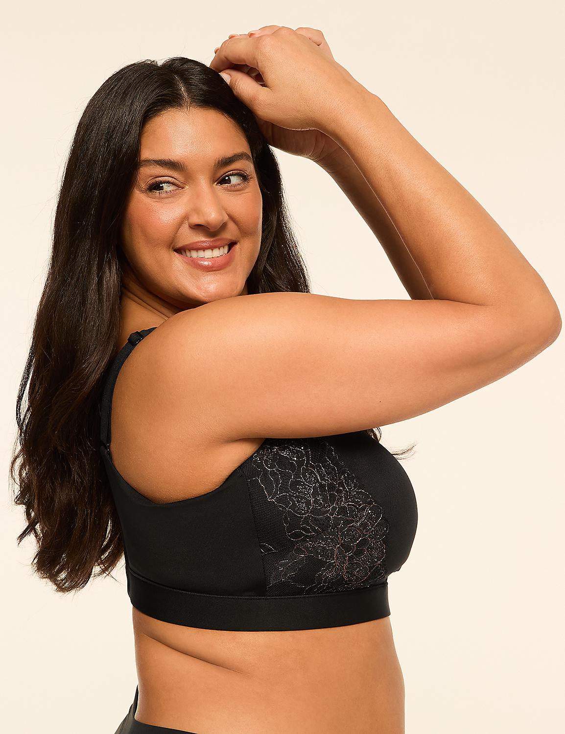 A smiling woman with dark hair in a black bra with lace detailing poses against a plain, light-colored background. Product Image 3