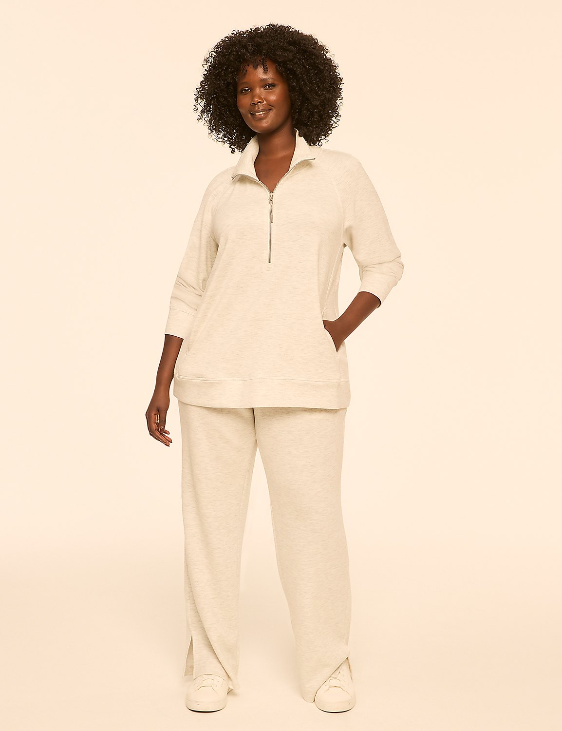 A woman in a light-colored loungewear set stands against a plain, light-colored background. Product Image 3