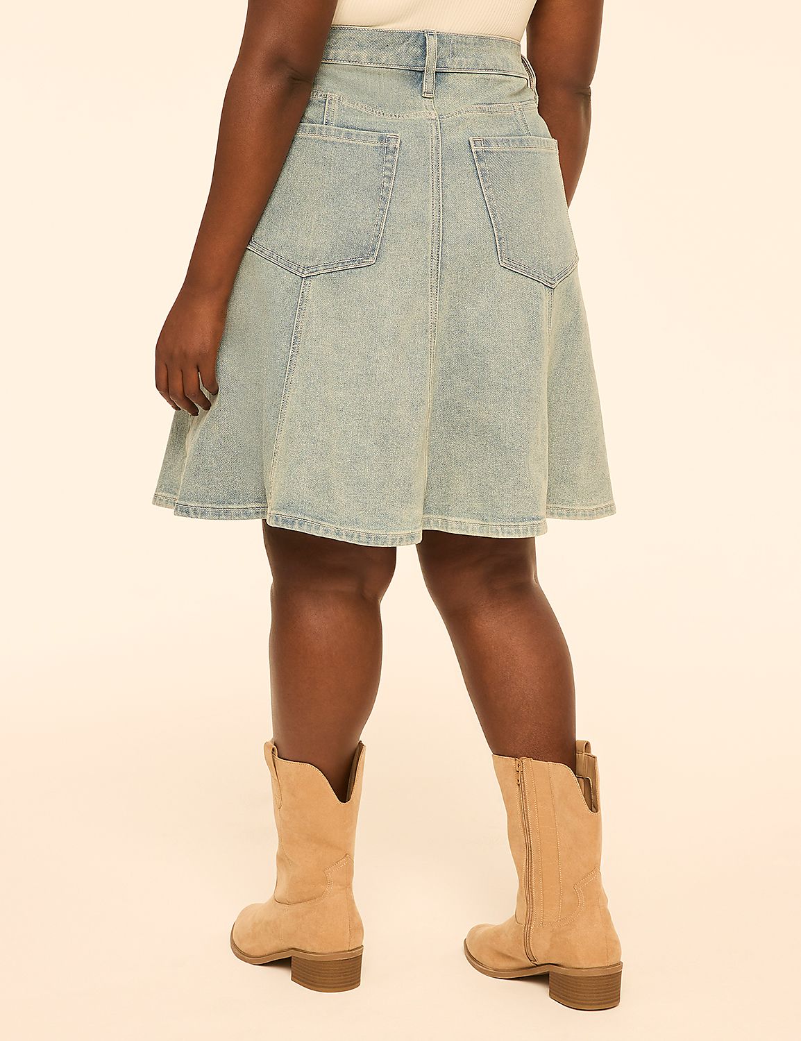 A person wearing a light-wash denim skirt and tan cowboy boots stands against a plain, light-colored background. Product Image 2