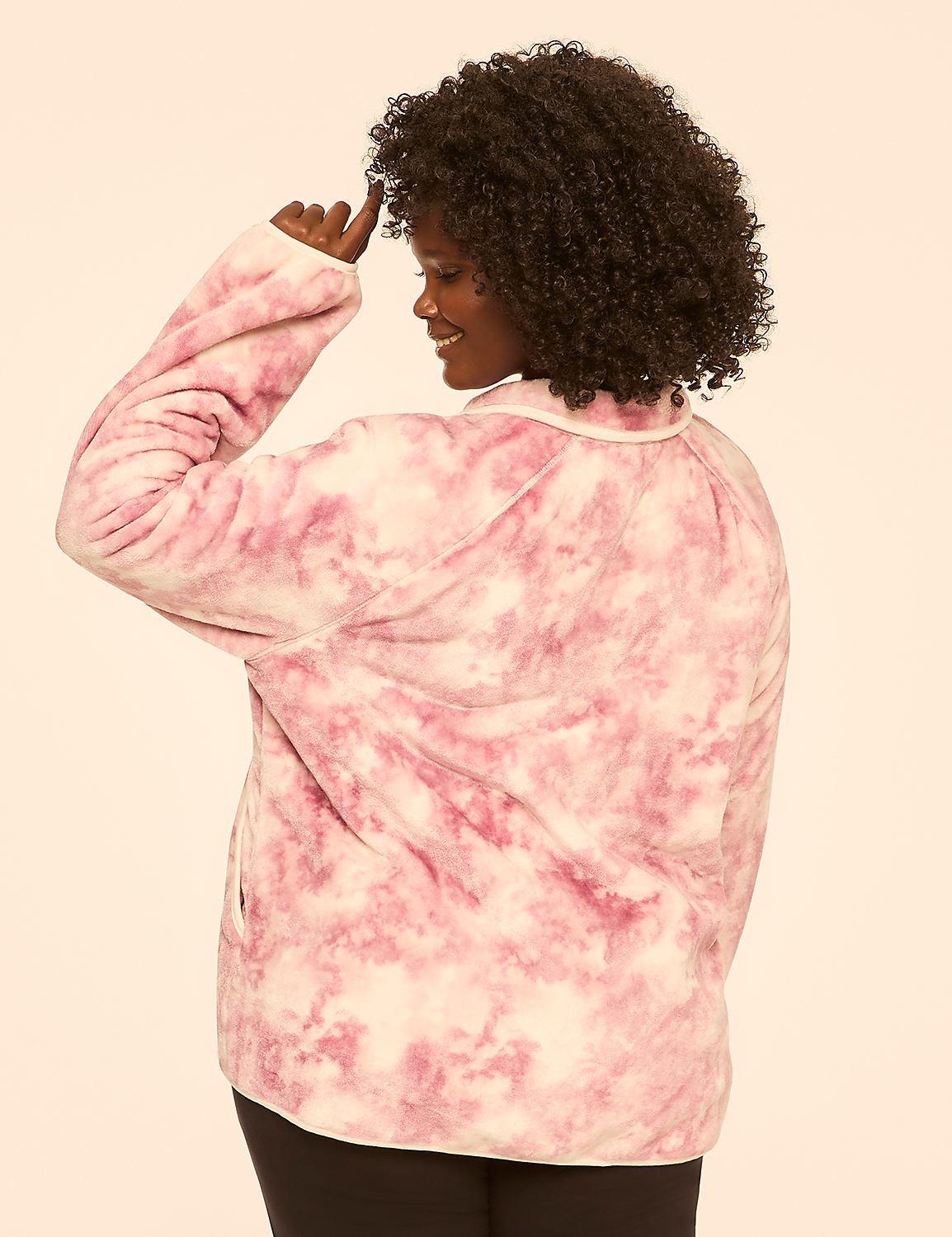 A woman in a pink tie-dye jacket stands against a plain, light-colored background. Product Image 2