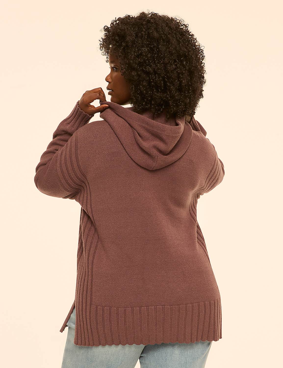 A woman in a mauve hooded sweater stands against a plain, light-colored background. Product Image 2