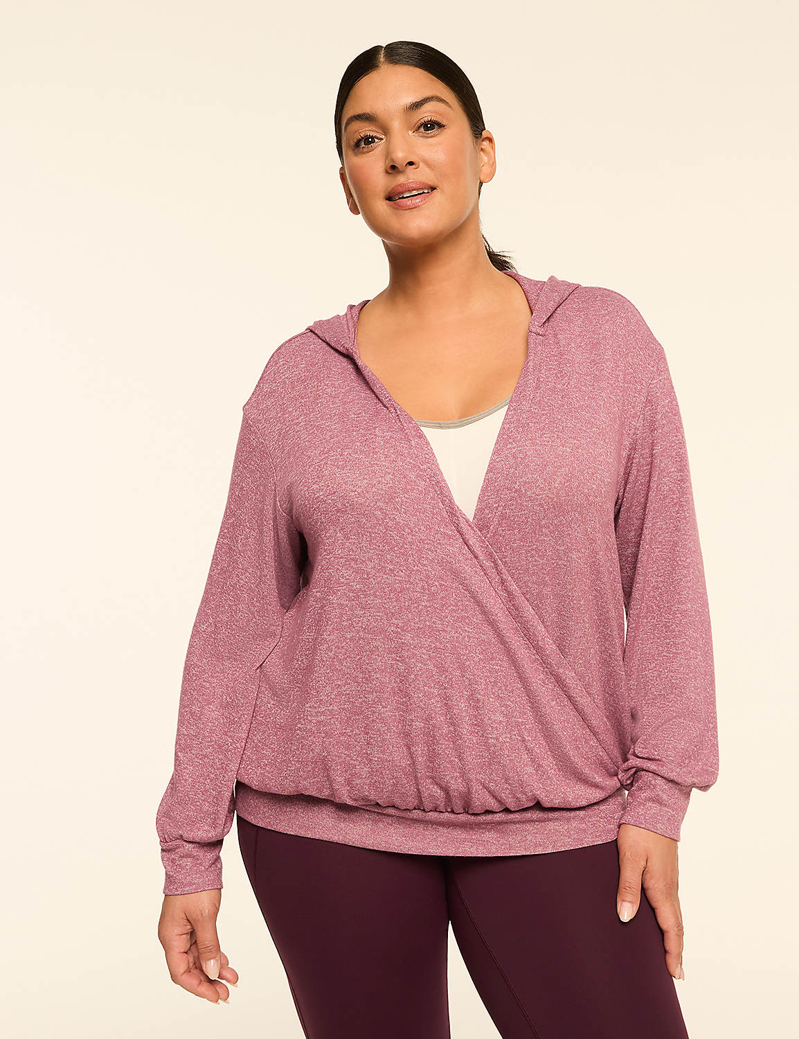 A woman in a mauve wrap hoodie and burgundy leggings stands against a plain, light-colored background. Product Image 1