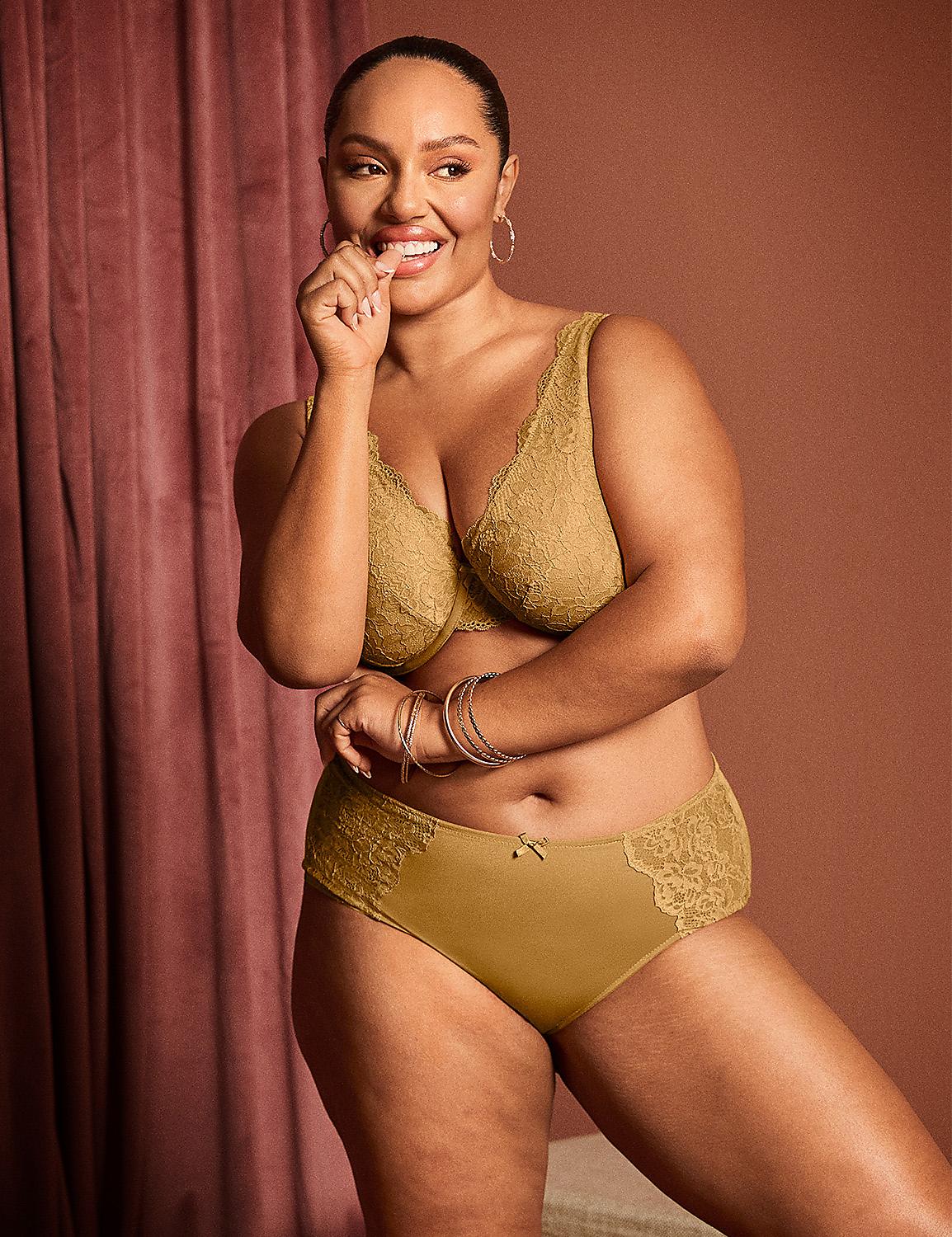 A smiling woman in a gold lace bra and matching underwear poses in front of a pink velvet curtain. Product Image 5