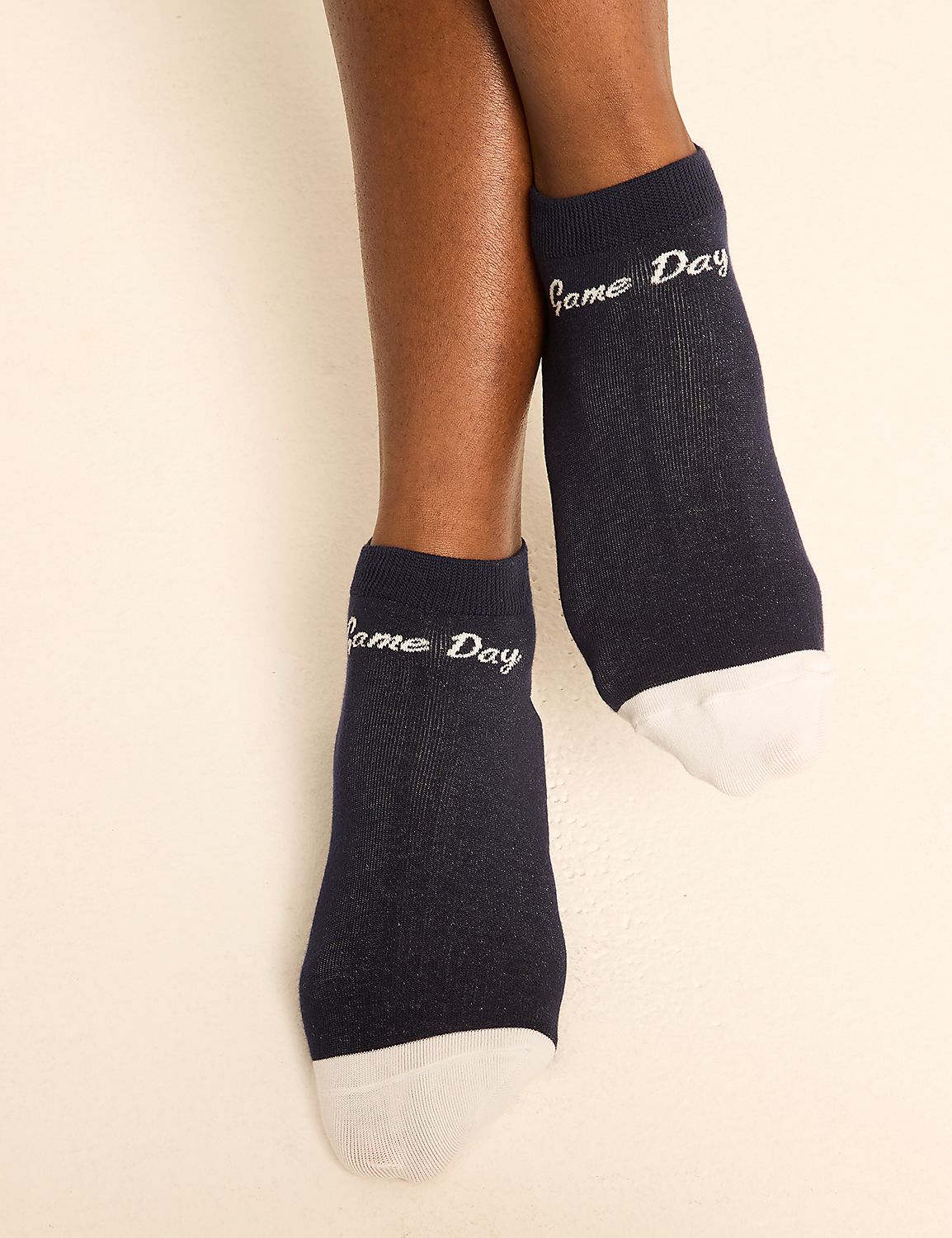 Dark blue "Game Day" socks with white toes are worn on a person's legs against a plain white background. Product Image 2