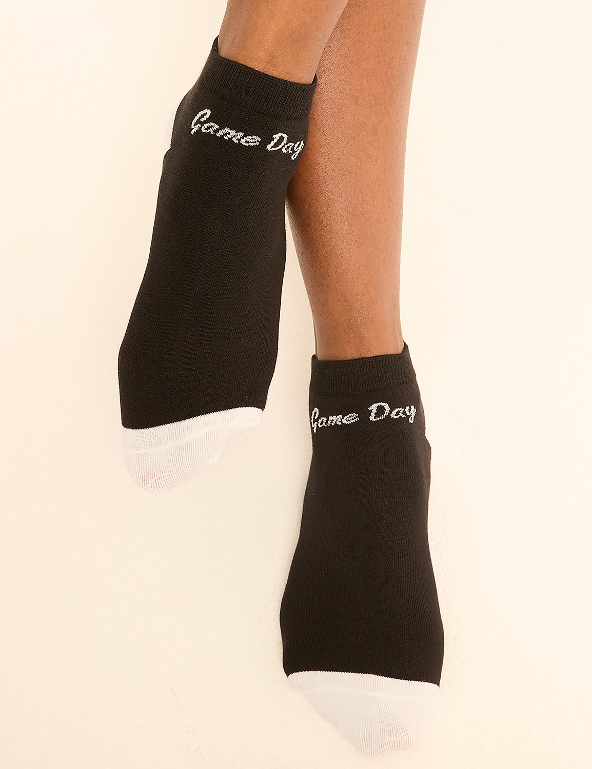Black ankle socks with "Game Day" embroidered on them are worn by a person against a plain, light-colored background. Product Image 2