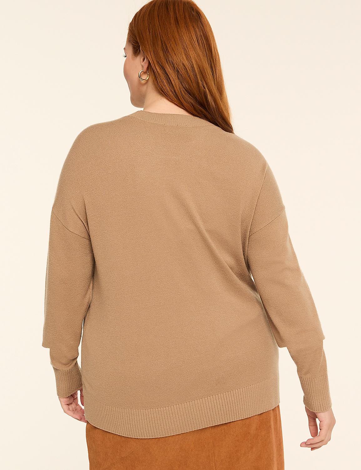 A woman with auburn hair, wearing a tan sweater and an orange skirt, stands against a plain beige background. Product Image 2