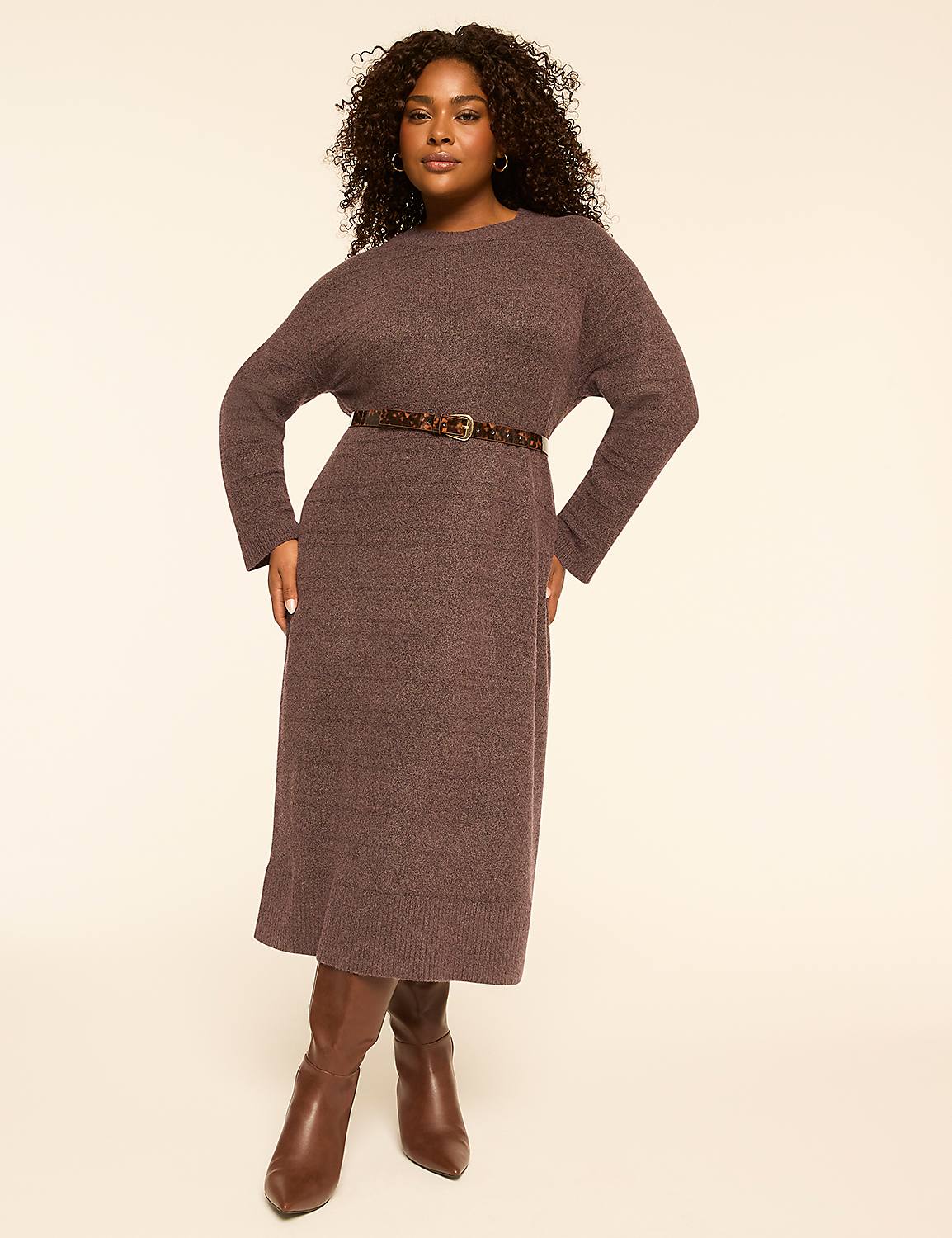 A woman in a brown knit dress and boots stands against a plain, light-colored background. Product Image 1