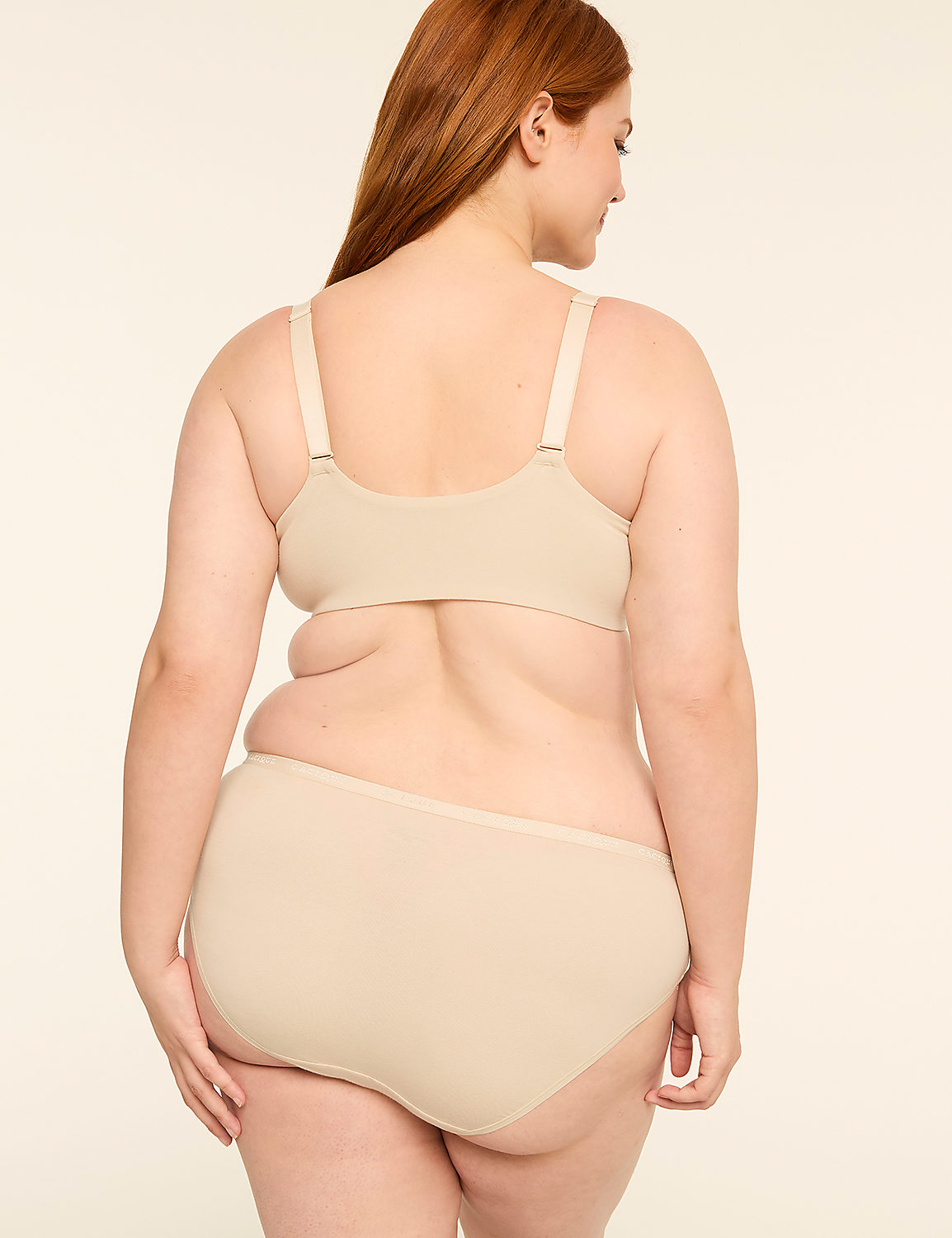 A woman in beige undergarments stands with her back to the viewer against a plain, light-colored background. Product Image 2