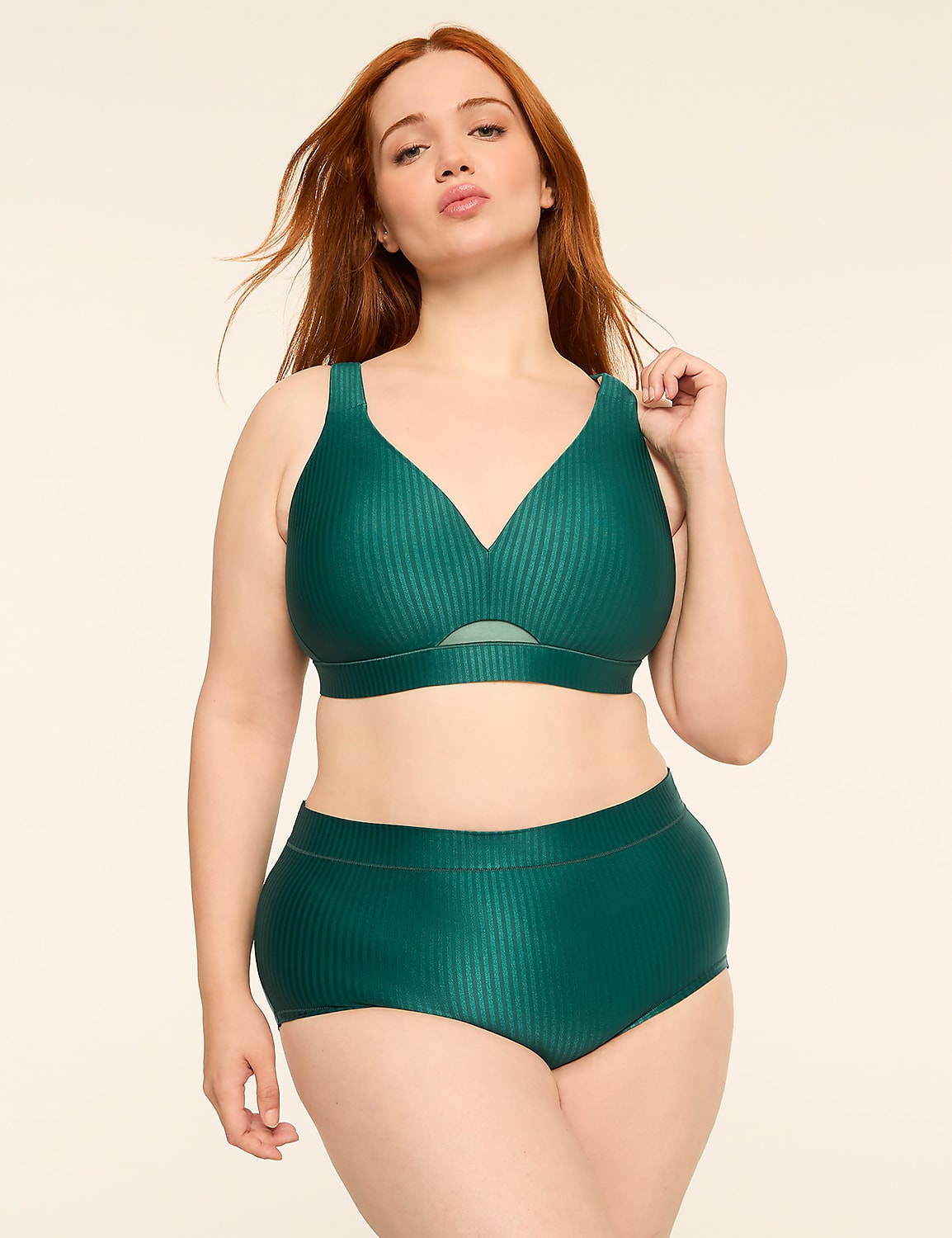 A woman with red hair poses in a green ribbed bikini against a plain, light-colored background. Product Image 4