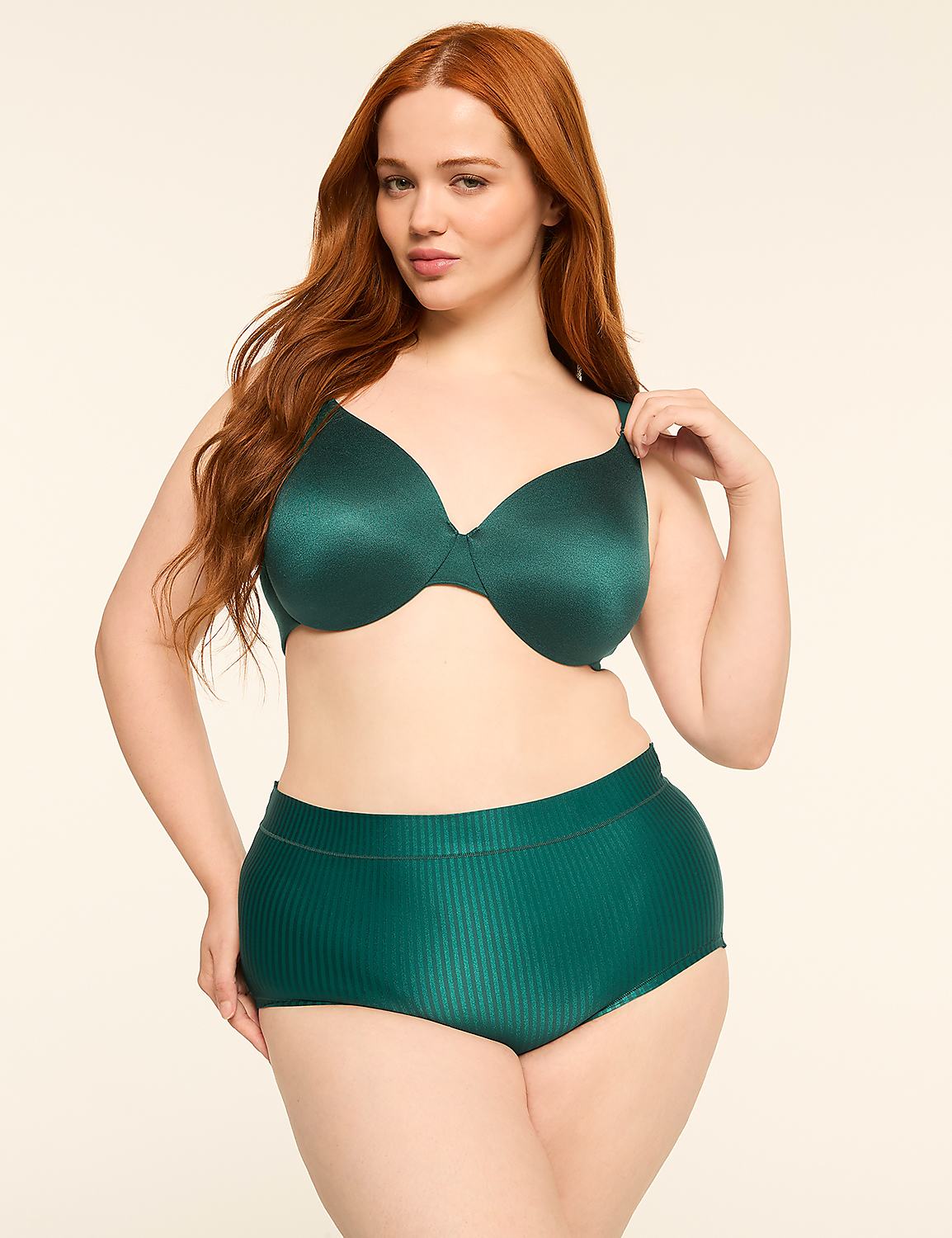 A woman with long red hair poses in a green bra and high-waisted underwear against a plain, light background. Product Image 4