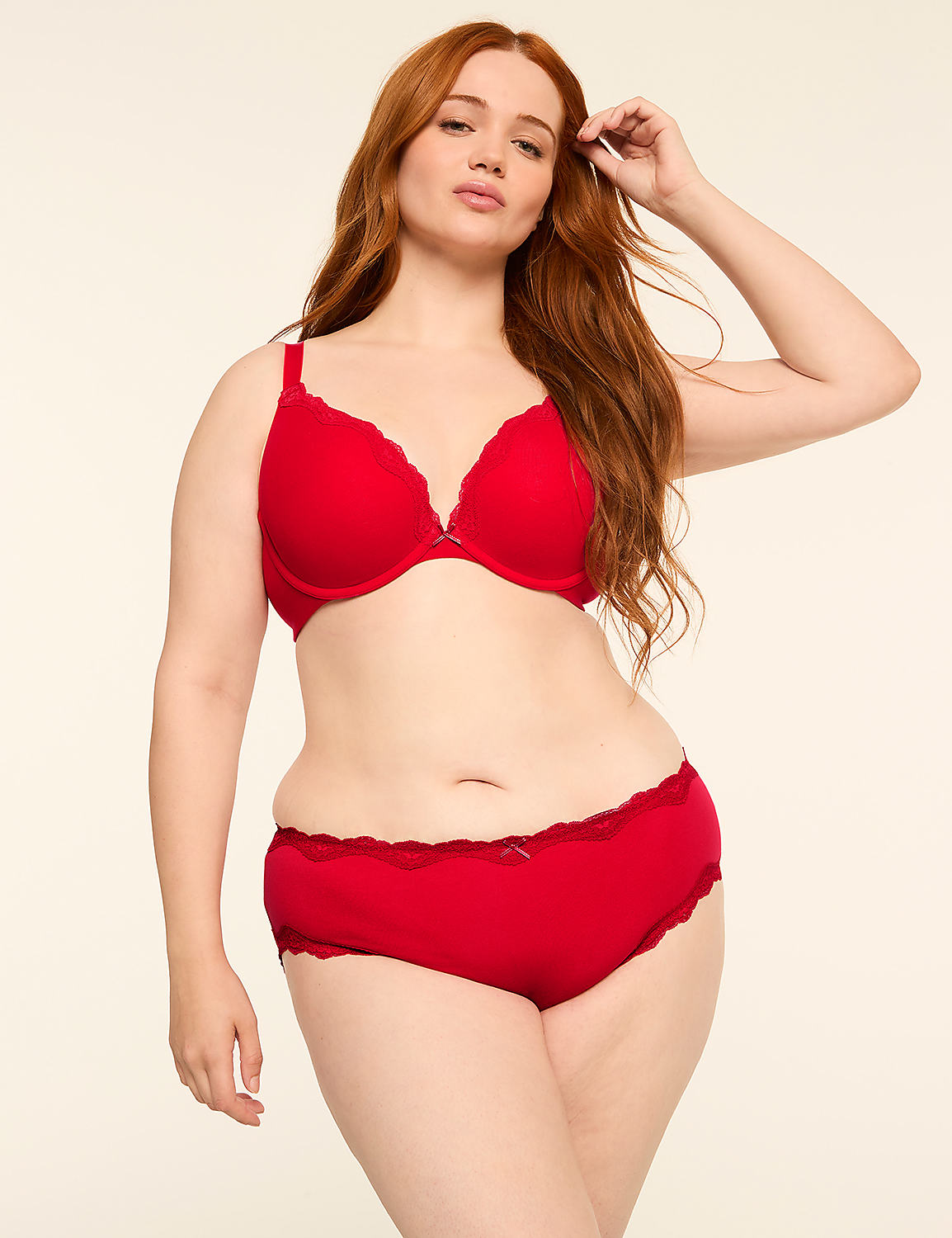 A woman with long red hair poses in red lingerie against a plain, light background. Product Image 4