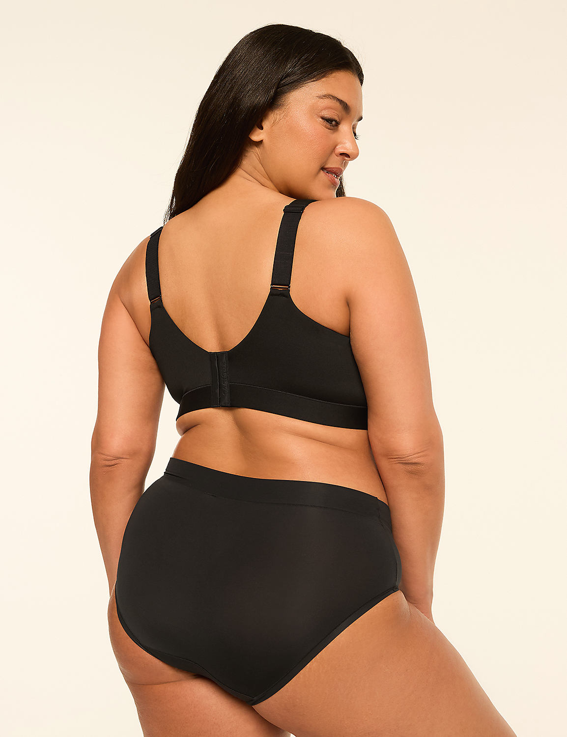 A woman in black underwear stands against a plain, light-colored background. Product Image 2