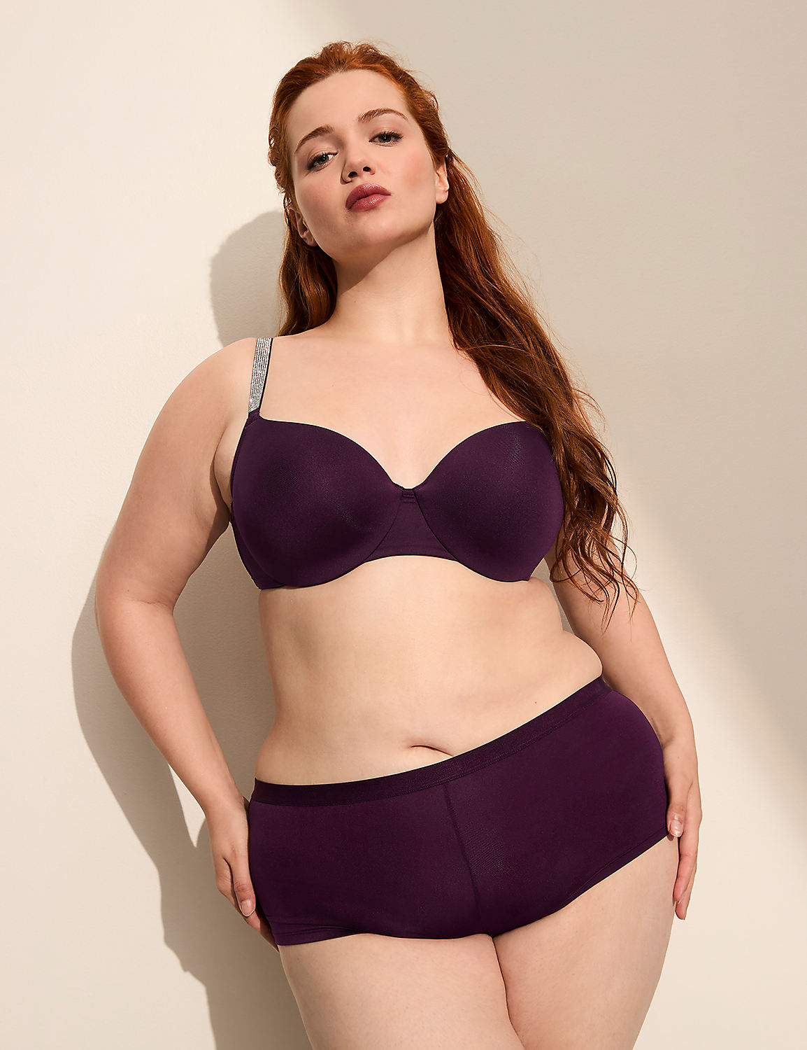 A woman with red hair poses in a purple bra and underwear against a plain, light-colored background. Product Image 4