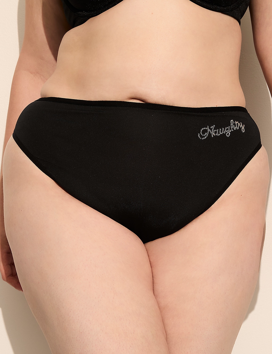 Black underwear with "Naughty" embroidered on the side is worn by a person against a plain background. Product Image 1