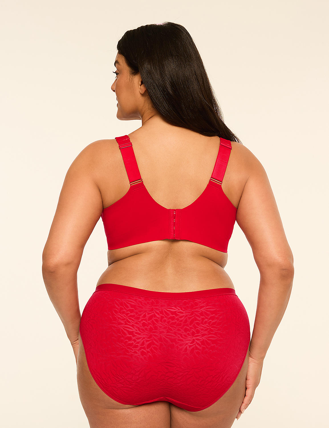 A woman in a red bra and matching patterned underwear stands against a plain, light-colored background. Product Image 2
