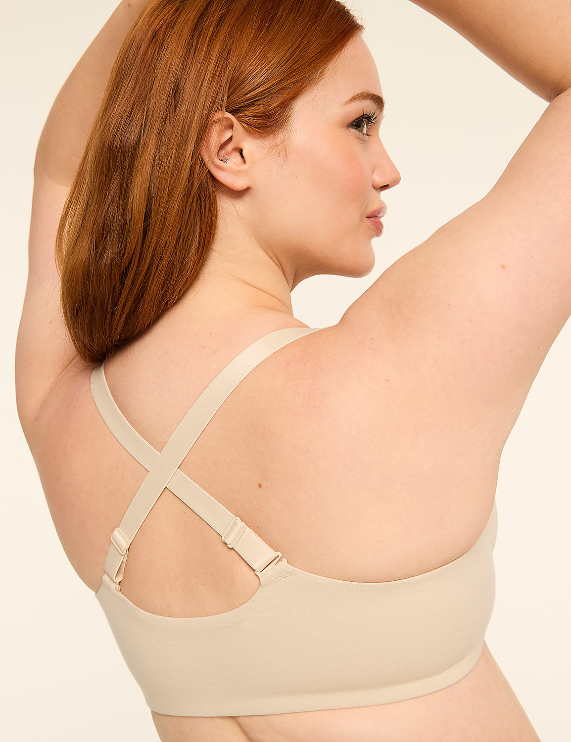 A woman's back is shown from behind, with her brown hair falling over her shoulders, against a plain, light-colored background. Product Image 5