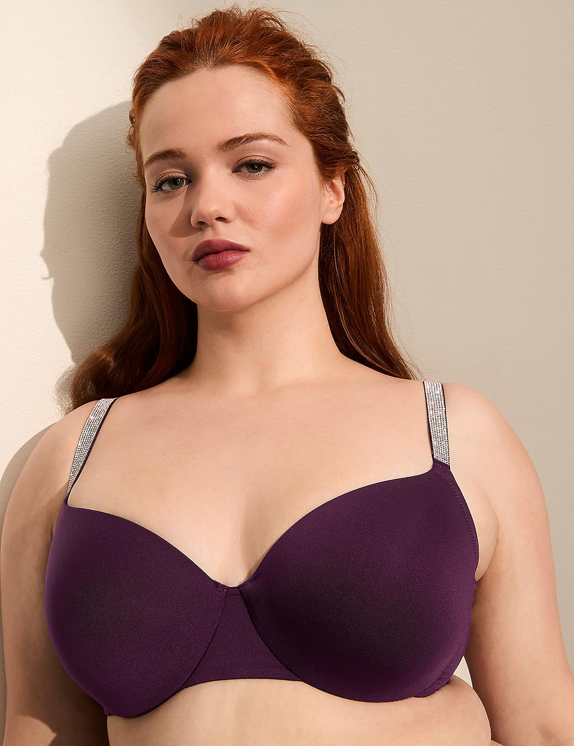 A woman with auburn hair poses in a dark purple bra with embellished straps against a plain, light-colored background. Product Image 1