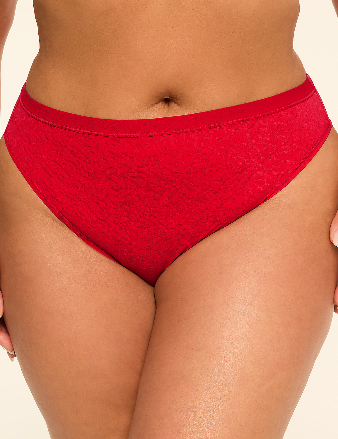 A close-up of a person wearing red underwear fills the foreground, with a plain, light-colored background. Product Image 1
