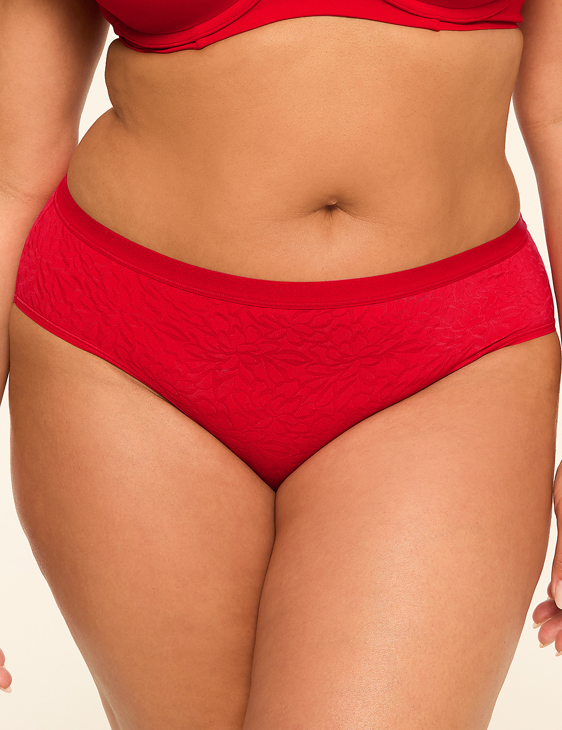 A close-up of a person wearing red underwear and a red bra against a plain background. Product Image 1