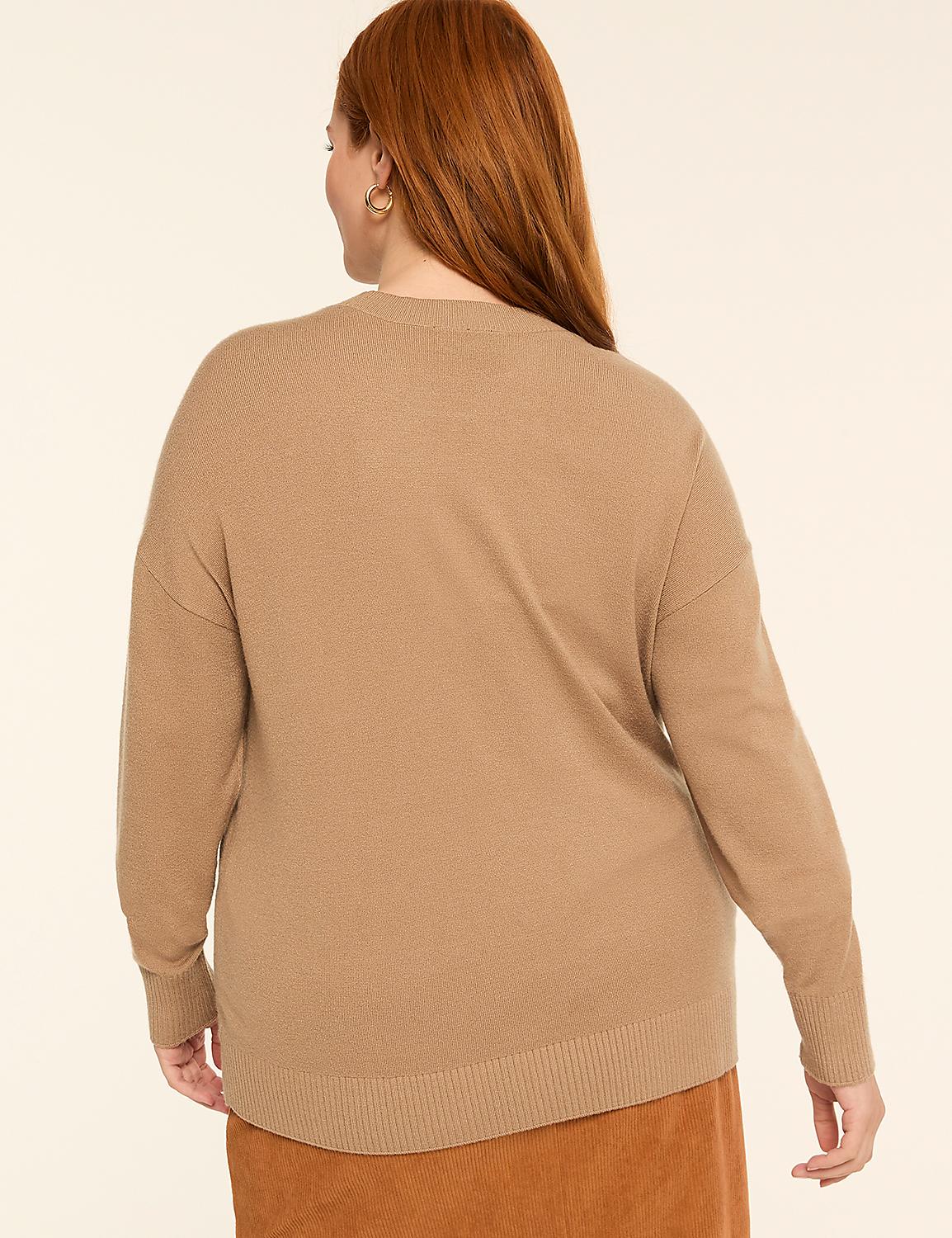A woman with auburn hair, wearing a tan sweater and an orange skirt, stands against a plain beige background. Product Image 2