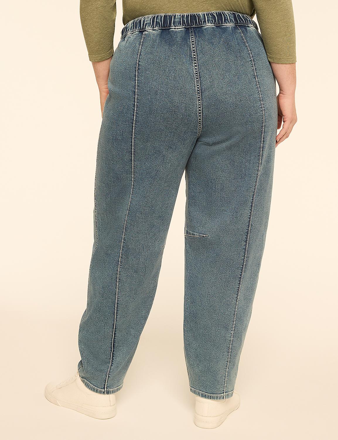 A person wearing loose-fitting denim pants stands against a plain, light-colored background. Product Image 2