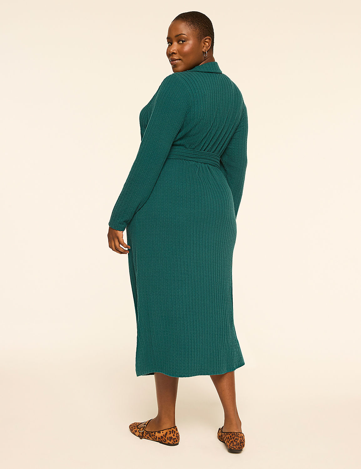 A woman in a teal ribbed dress and leopard print flats stands against a plain cream background. Product Image 2