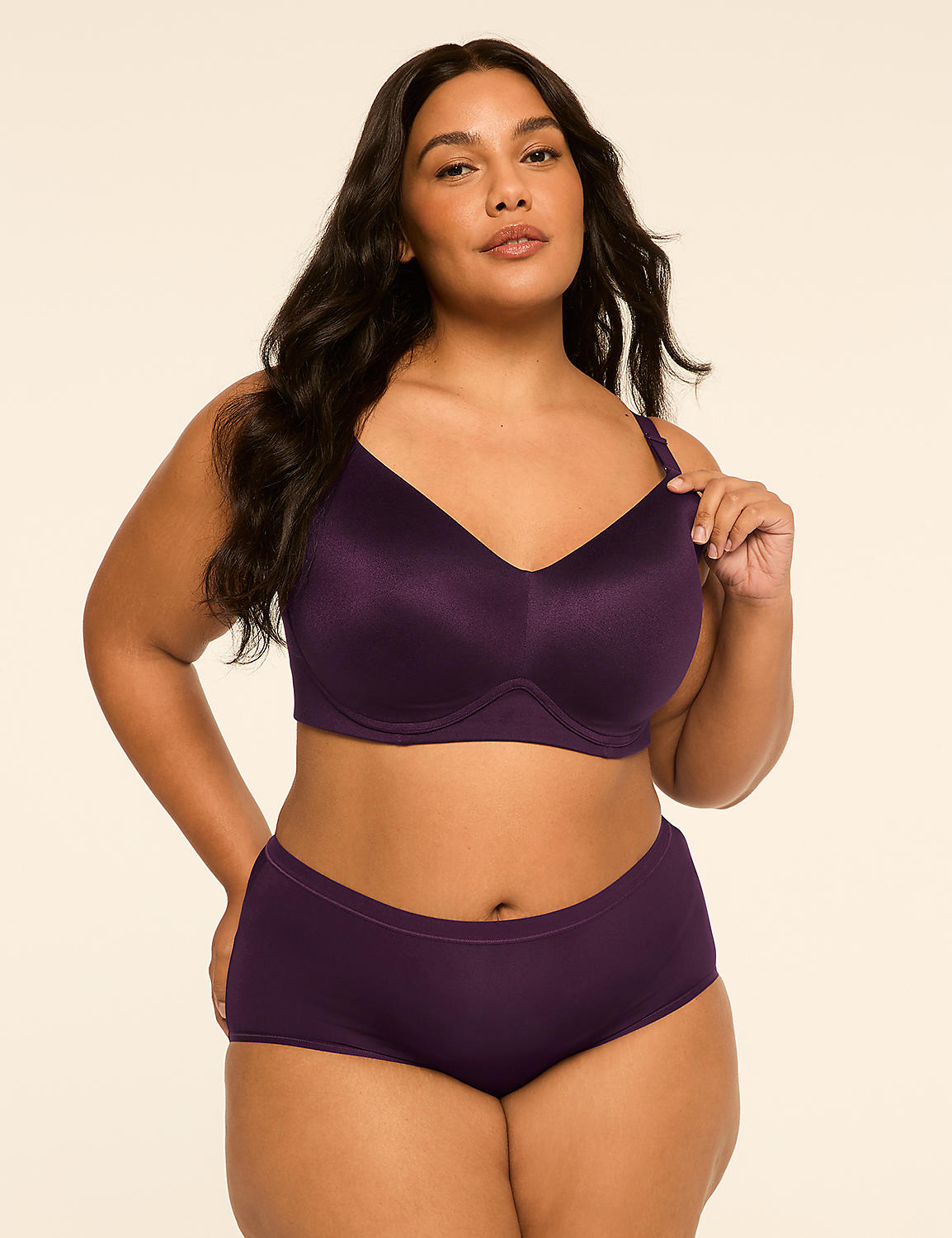 A woman in a purple bra and matching underwear stands against a plain, light-colored background. Product Image 4