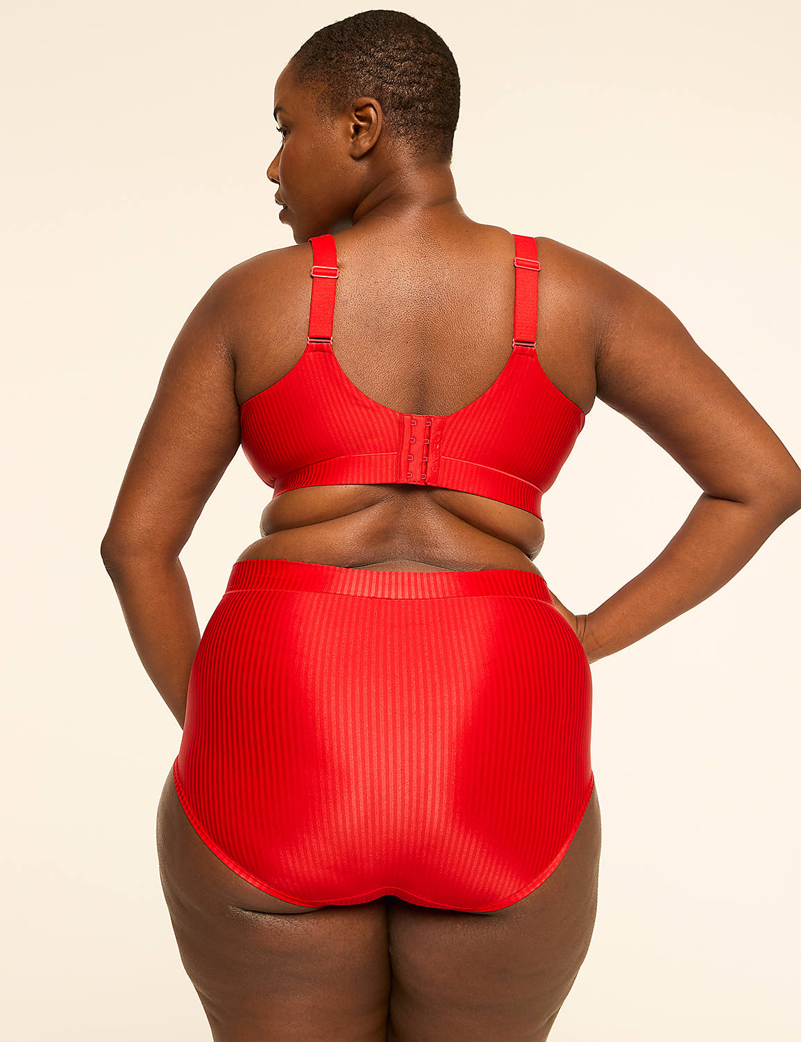 A woman in a red ribbed bra and high-waisted briefs stands against a plain, light-colored background. Product Image 2