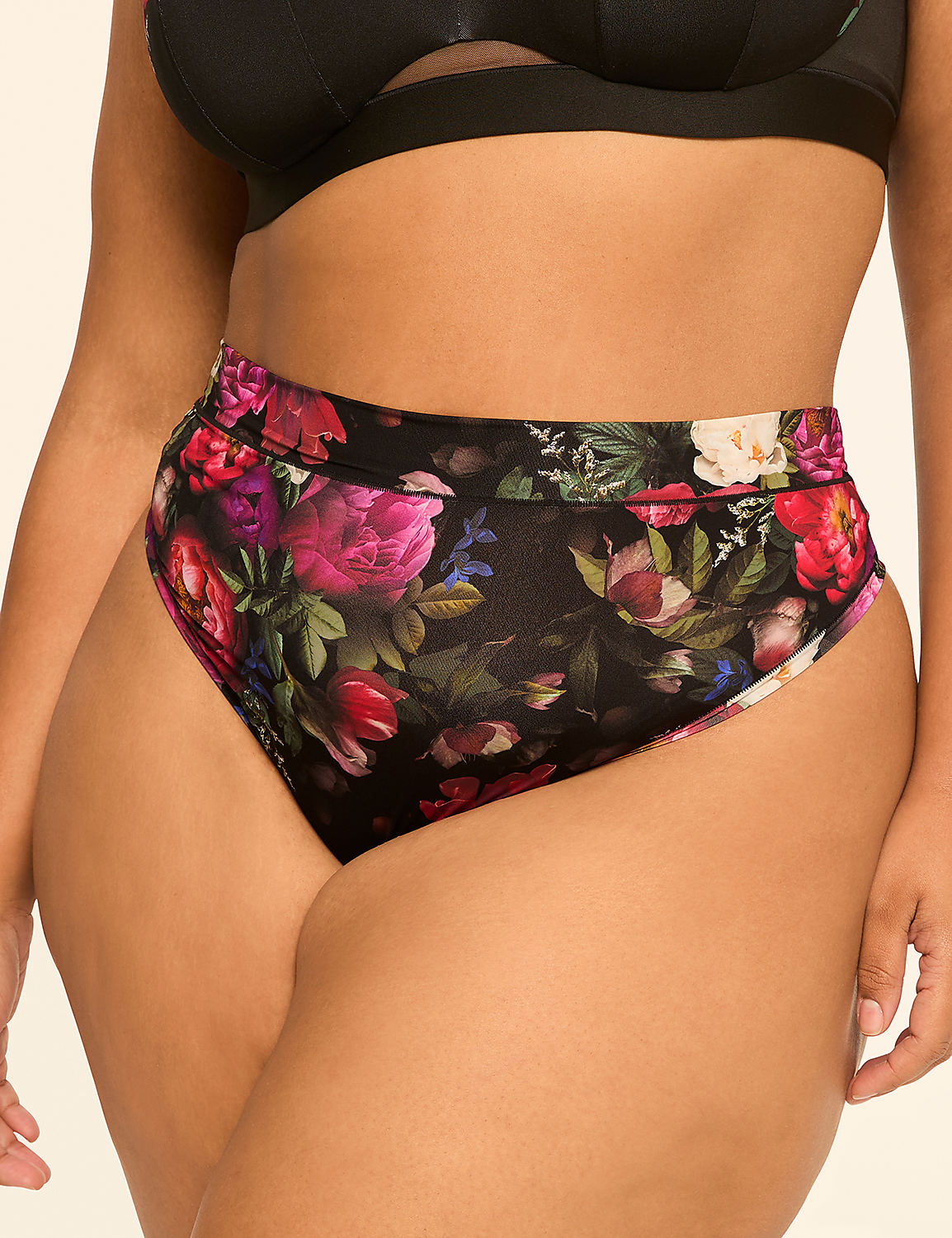 A person's midsection is adorned with high-waisted floral print underwear against a plain background. Product Image 1