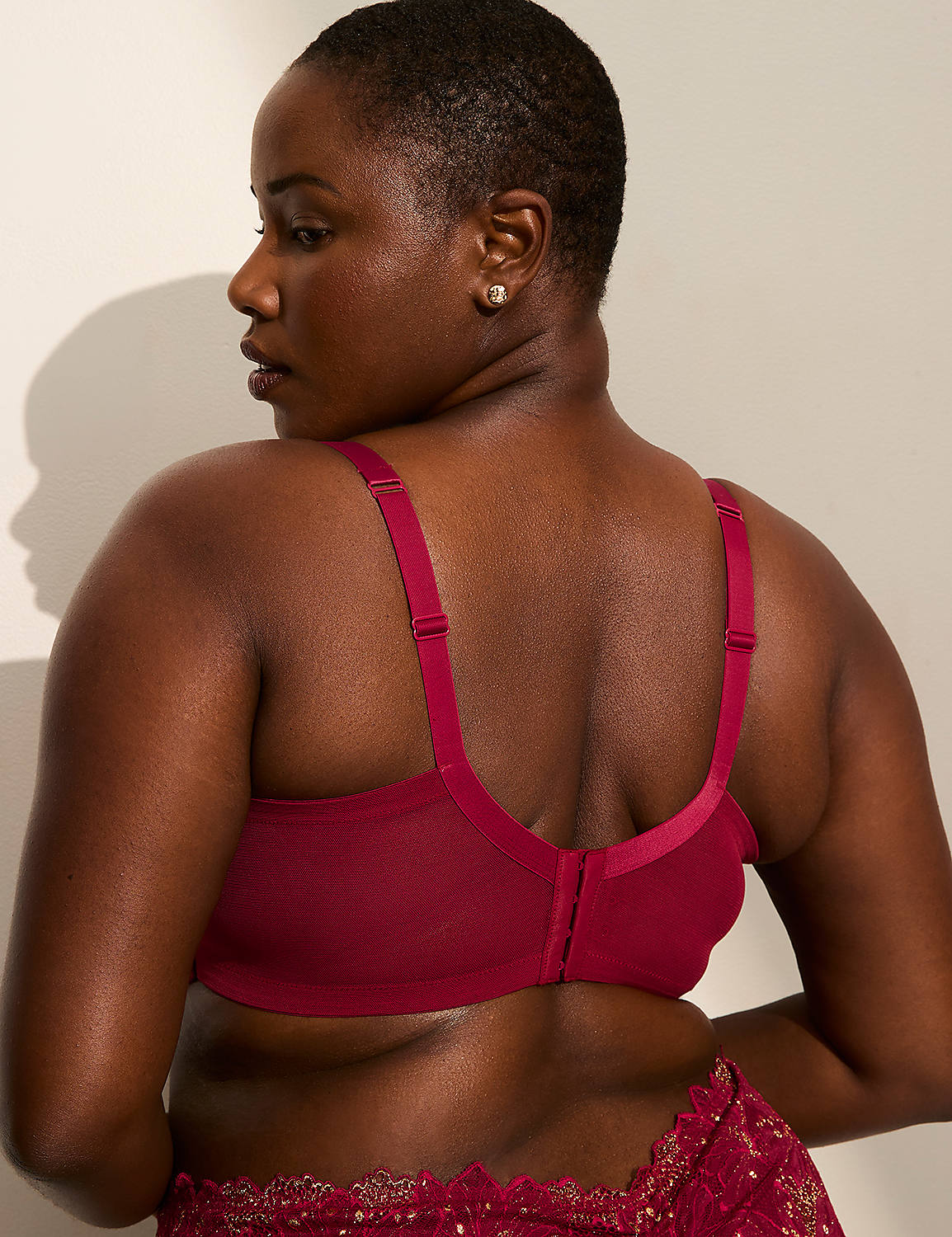 A woman in a maroon bra is shown from the back, with a plain wall in the background. Product Image 3