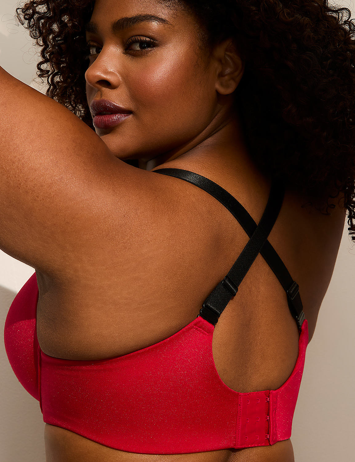 A woman with curly dark hair wears a red bra with black straps, her back turned to the viewer against a plain, light-colored background. Product Image 5