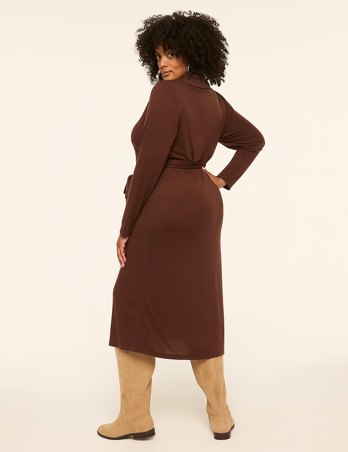 A woman in a brown dress and tan boots stands against a plain, light-colored background. Product Image 2