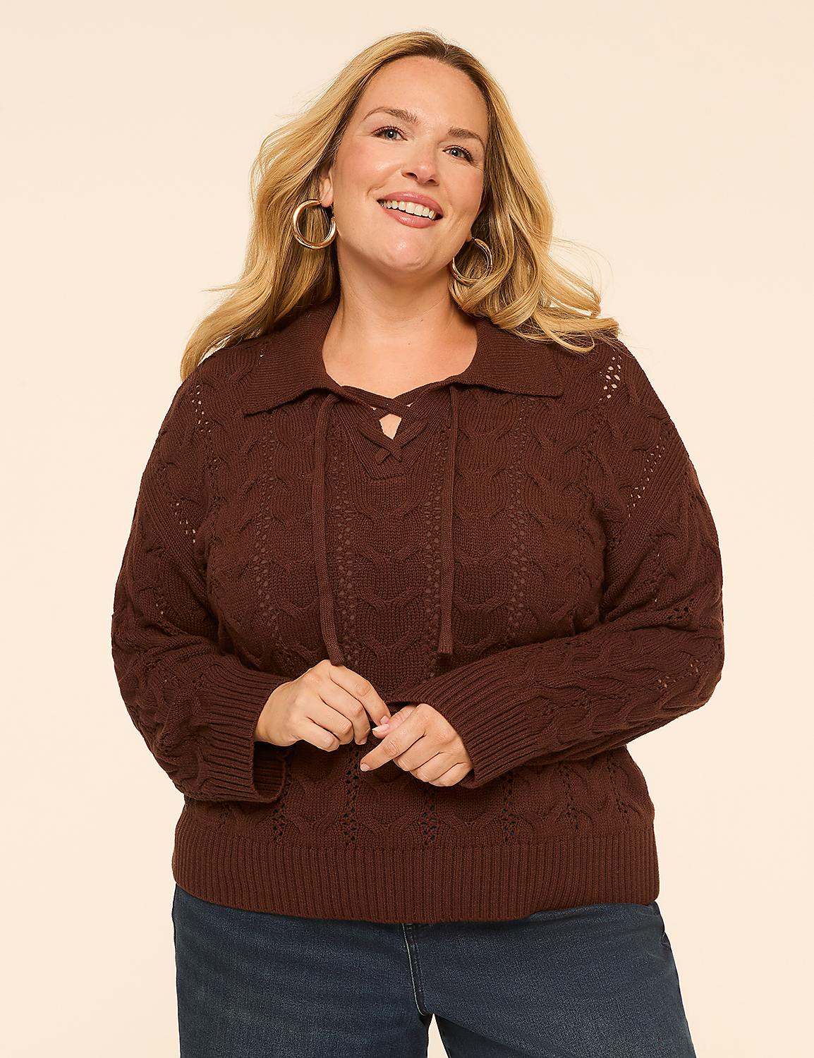 A smiling woman in a brown cable-knit sweater with a lace-up collar stands against a plain, light-colored background. Product Image 1