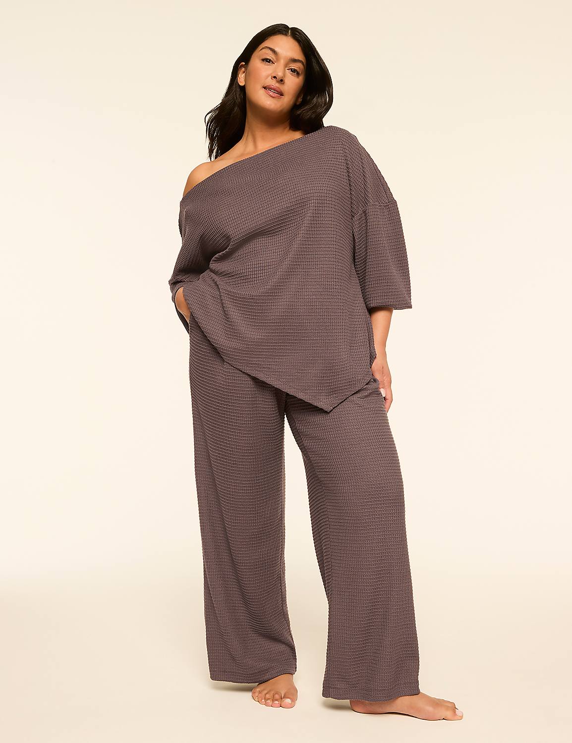 A woman in a grey loungewear set stands against a plain, light-colored background. Product Image 3